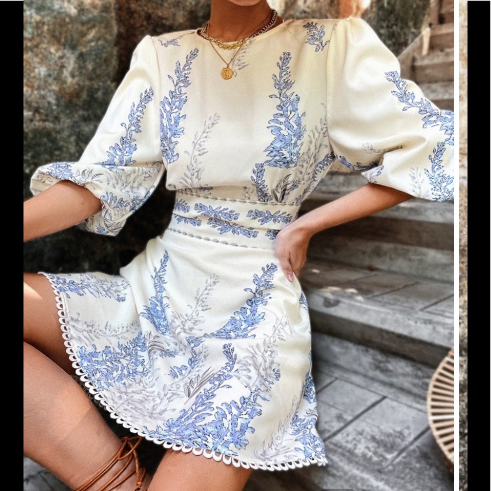 Sz L Top and skirt attached at center waist. Puffy sleeves and waist ties Nwt